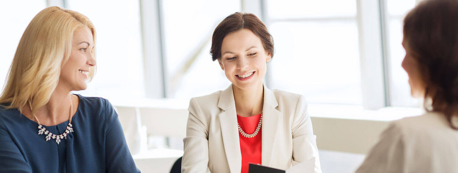 women discussing business loans