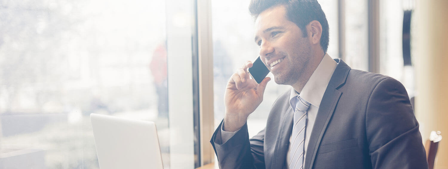 Man talking on the phone with a smile