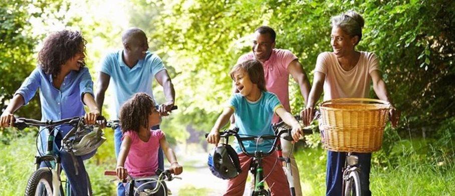 Happy family riding their bikes together