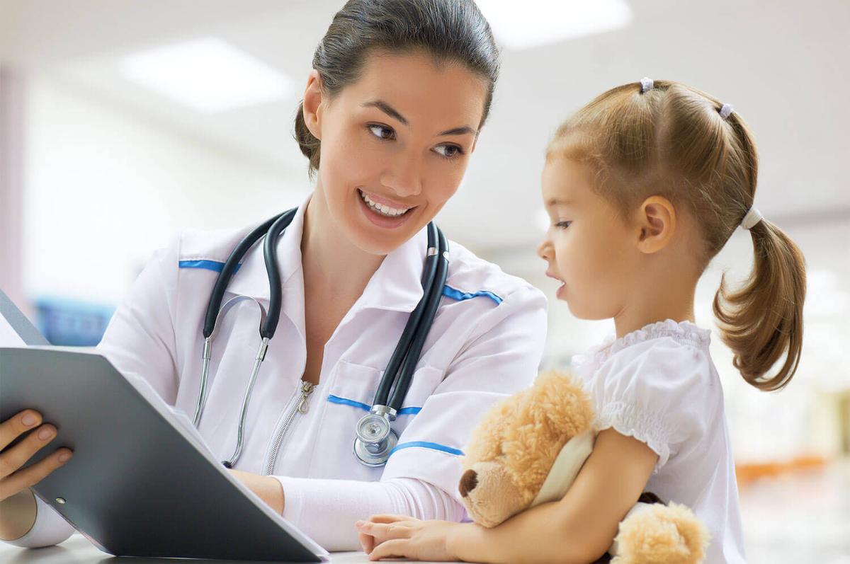 doctor showing little girl a chart