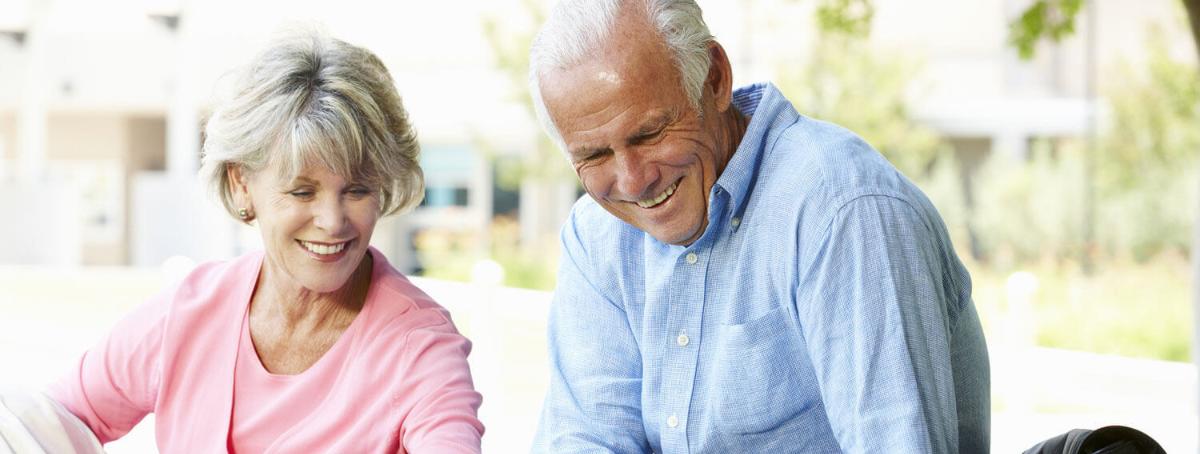 Elderly couple laughing