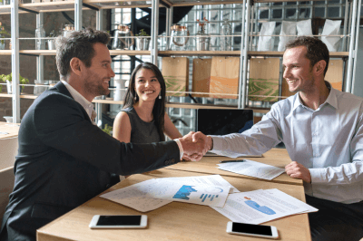 Man in business suit shaking a hand in business suit