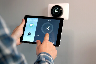 Person using app to control thermostat