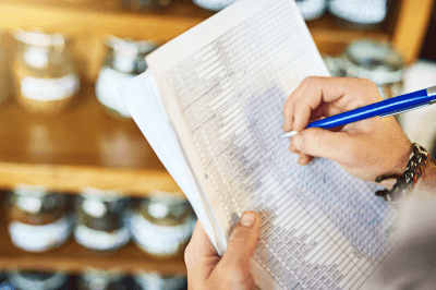Business owner taking inventory of supplies