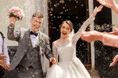 bride and groom walking down the isle to meet their guests