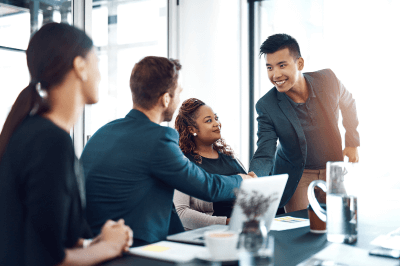Employees gathered around boss