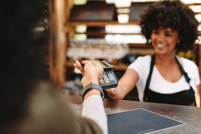 Cashier checking out customer