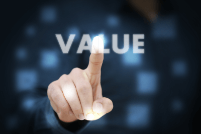 a finger pointing at the word value