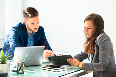 business owner having a financial review with their commercial banker