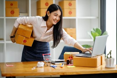 young business woman checking laptop