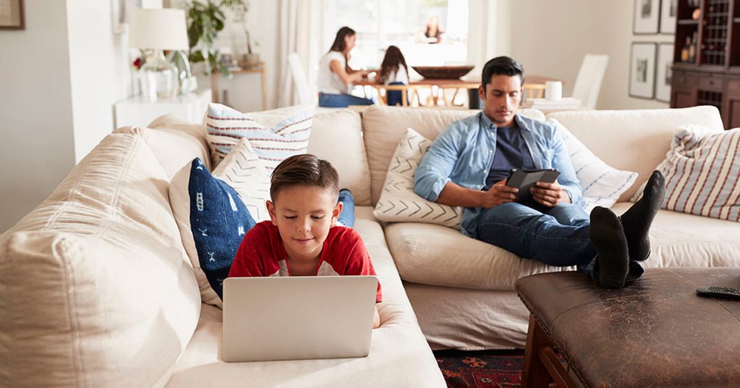 father and son hanging out on the couch