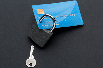 lock and key attached to a credit card