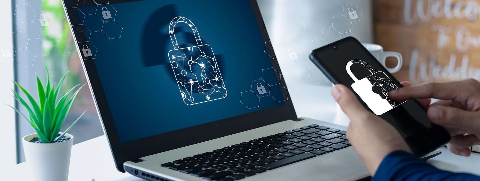 laptop and phone displaying lock symbol