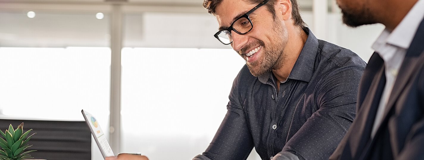 Happy man working on Laptop