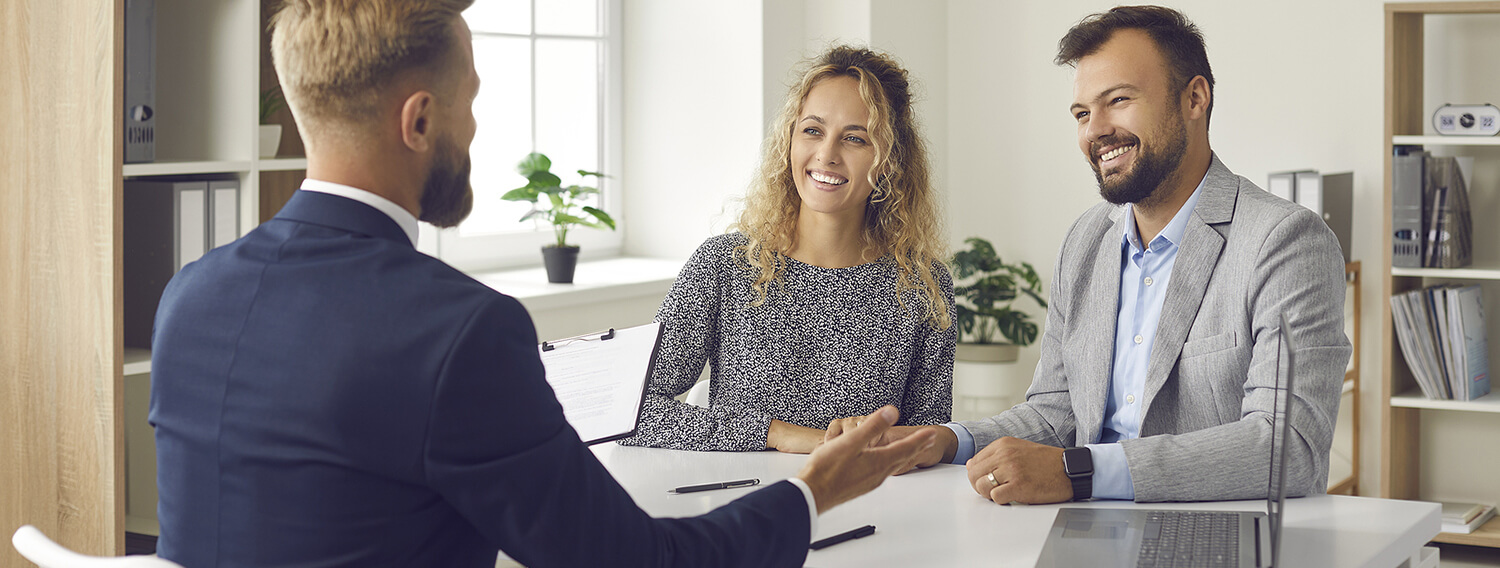 Business man having a meeting with a young couple