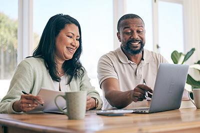 Couple looking at their laptop