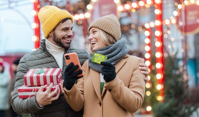 Photo of couple holiday shopping using their FNBT Debit Card