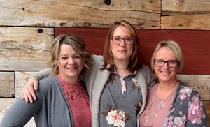 3 women posing for photo