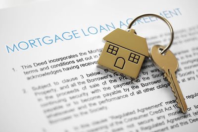 pay off home early document with key on top