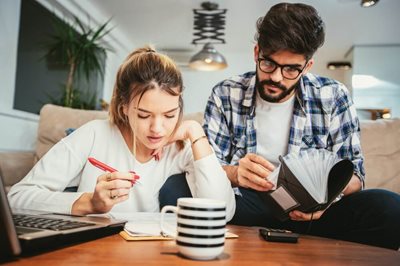 young couple looking at paperwork 