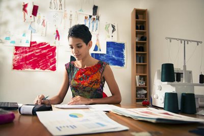 young business woman at design table 