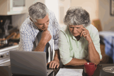 Couple looking at laptop