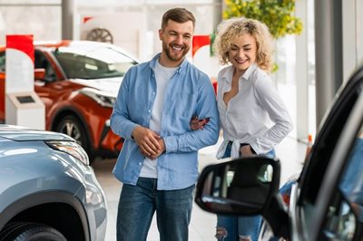 a couple is happy car shopping